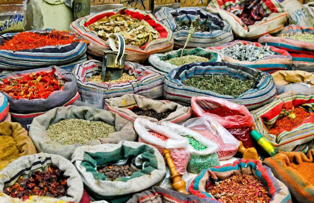 Spice market at Khan al Khalili in Cairo with baskets full of Spices and Herbs